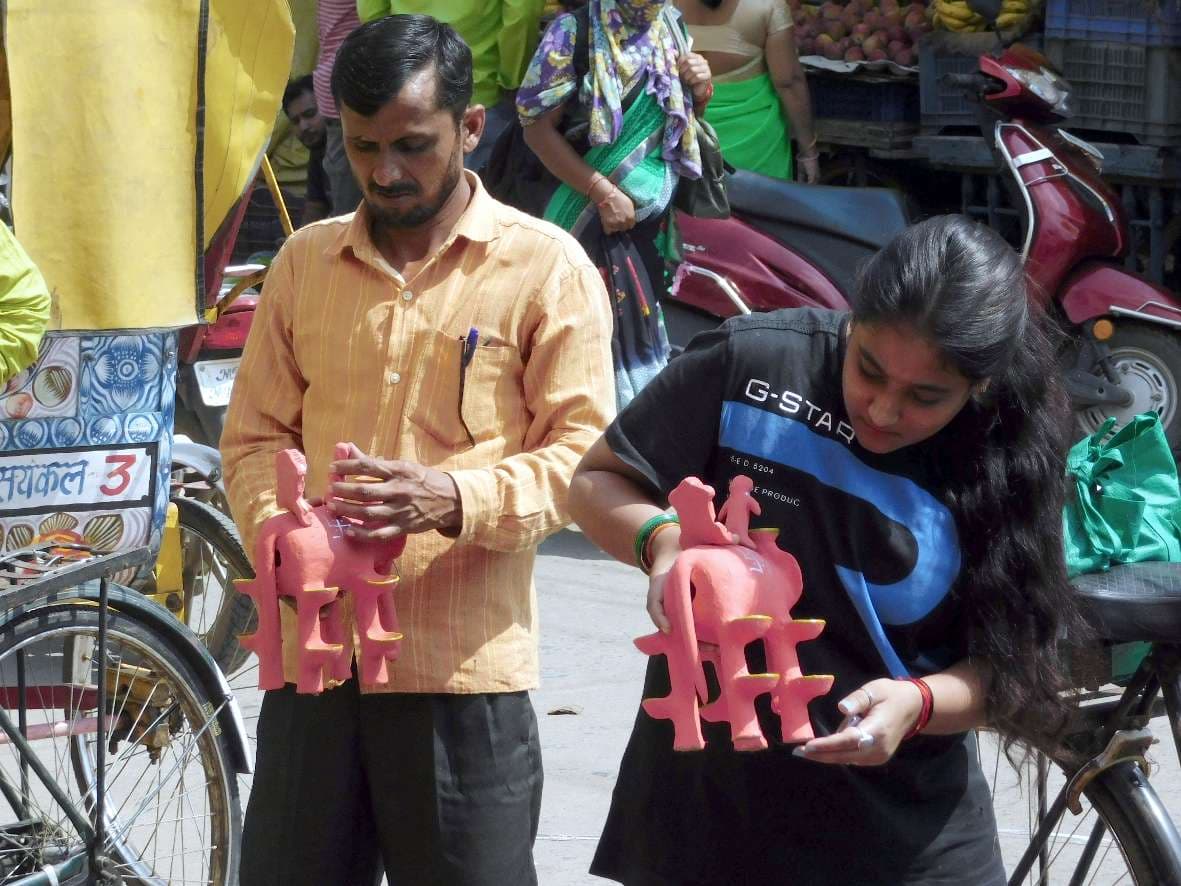 Women shopping for elephants in markets for Mahalaxmi Puja